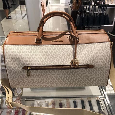 michael kors duffel bag with wheels|Michael Kors duffle bag sale.